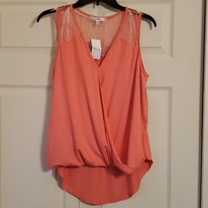 Sleeveless tunic style top